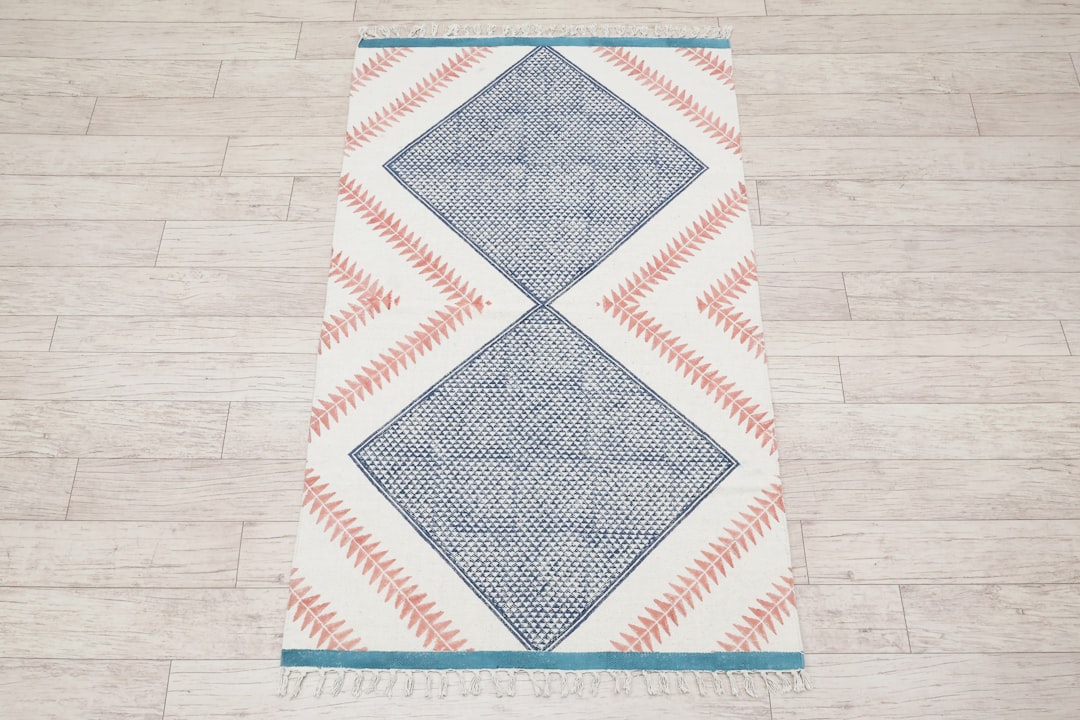 category-04 Handmade cotton rug with tassels featuring blue and pink geometric design, perfect boho hallway runner or area rug, adding warmth, texture, and artisanal charm to modern and traditional interiors. Shop Now:- https://www.etsy.com/listing/1906565397/handmade-cotton-rug-with-tassels-boho